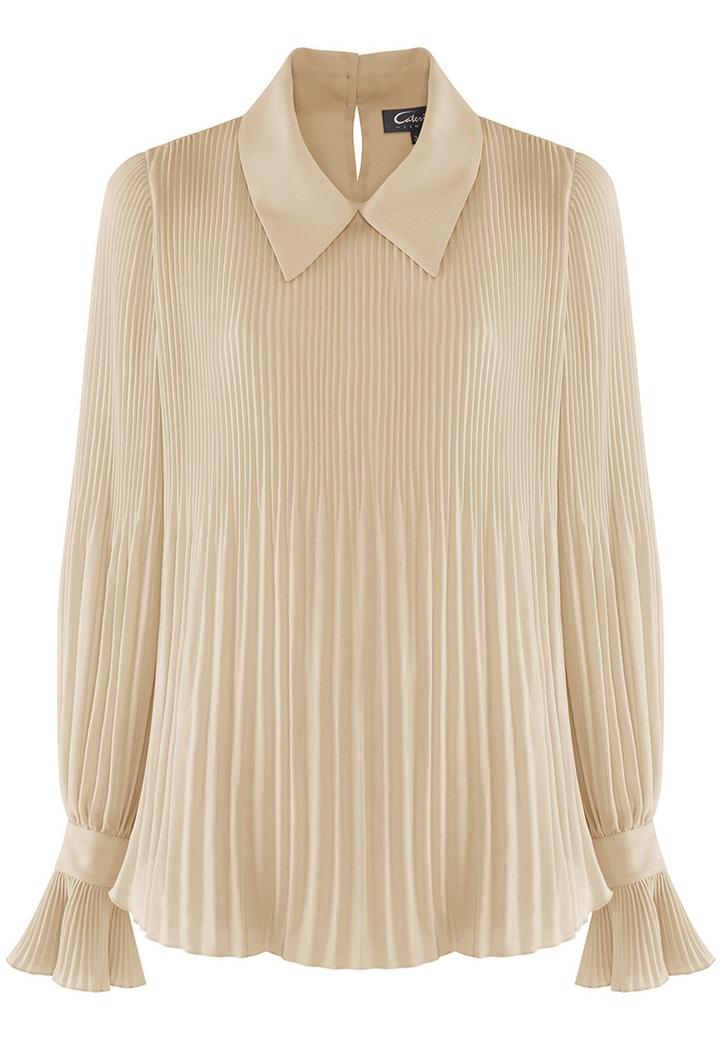 Jakie bluzki idealnie komponują się ze spódnicą plisowaną?